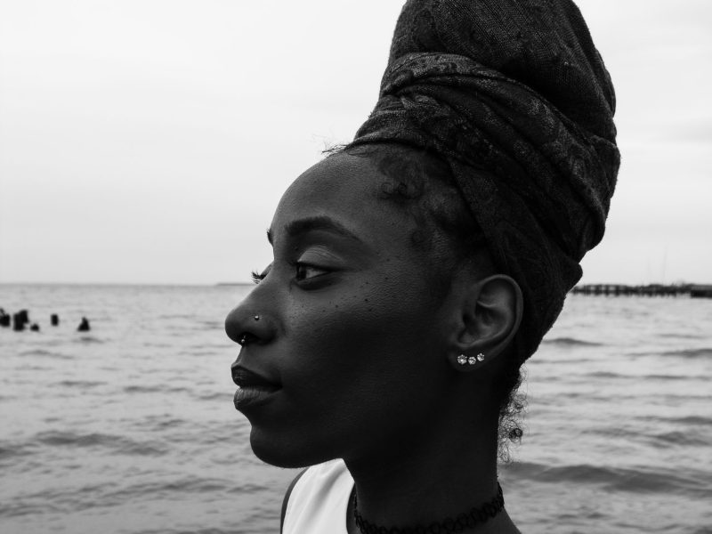 Black and white photo of a person with brown skin.