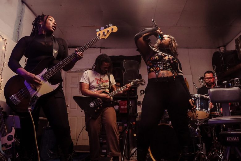 From left to right: Sienna Mahoney (bass), Stephen Peniston (guitar), Pangelica (lead vocals), Zach Inschol (drums)