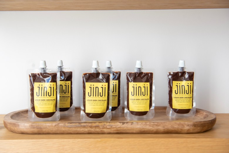 A row of liquid dark chocolate on display at Jinji Chocolate. Photo Credit: Philip Muriel.