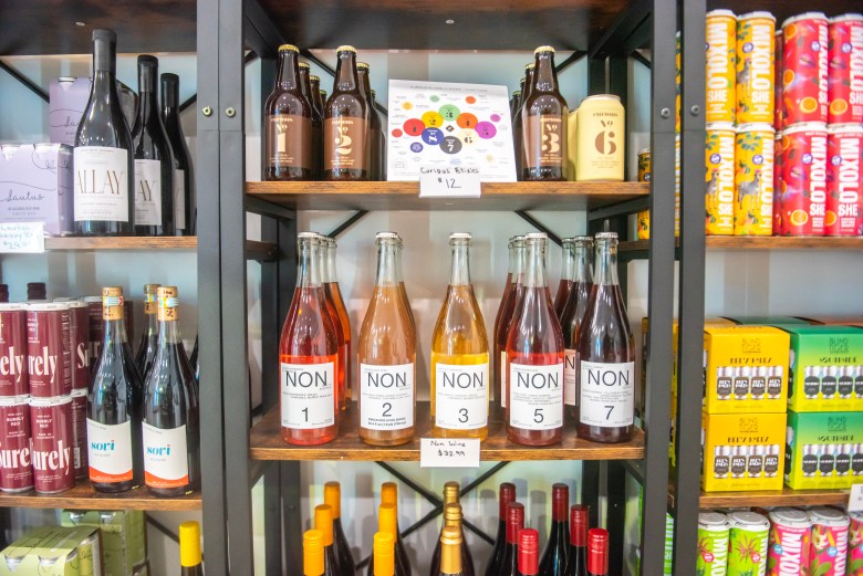 Rows of non-alcoholic and zero-proof beverages on display. 