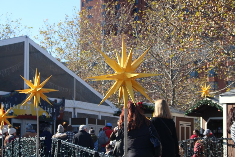 People wait in line at the Baltimore Christmas village.