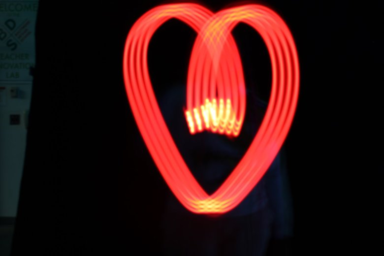 Red swirls of light in the shape of a heart.