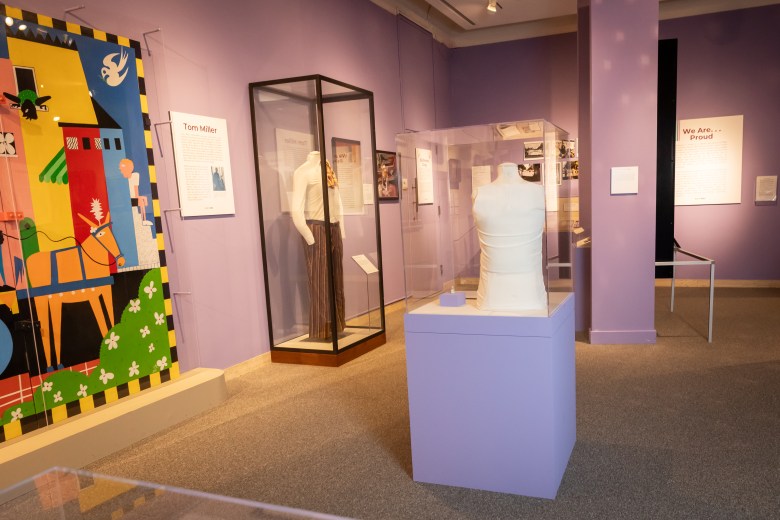 A photo of the exhibit. Pieces of art and memorabilia in display cases.