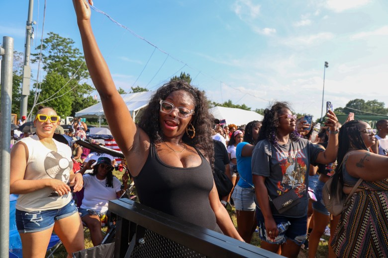 A person raises their arm as they dance.