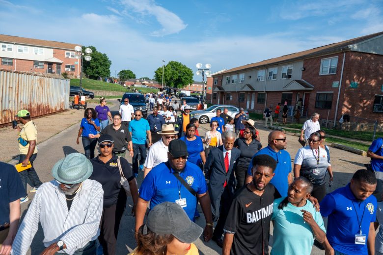 Baltimore Mayor Brandon Scott and community members at a walk held in Brooklyn on July 5, 2023.