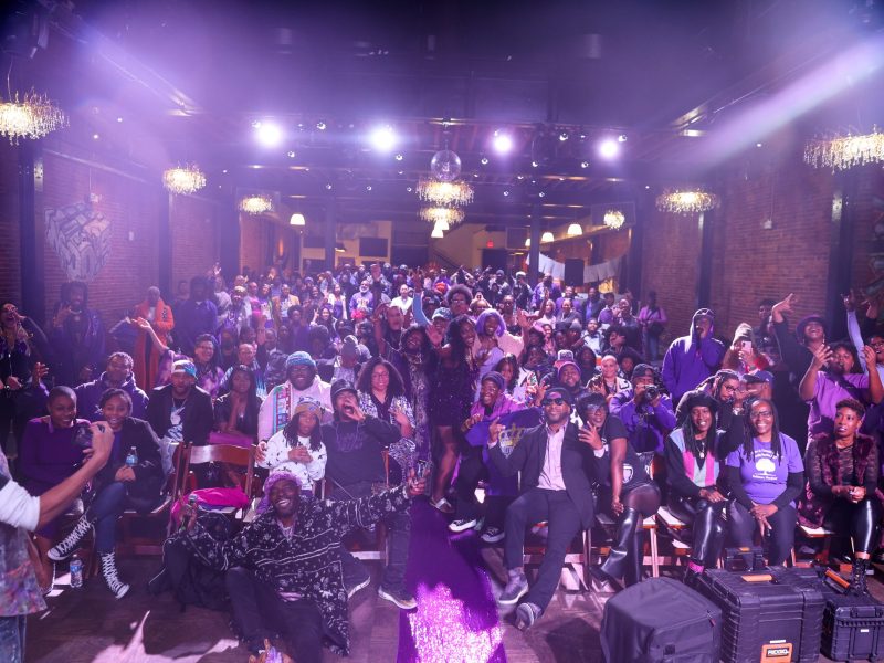 a group photo of award winners poses for a photo.