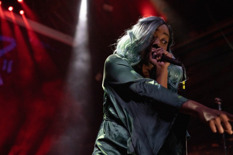 A rapper performers at a hip hop showcase. 