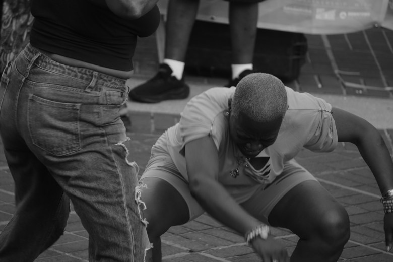 Two people dance to music