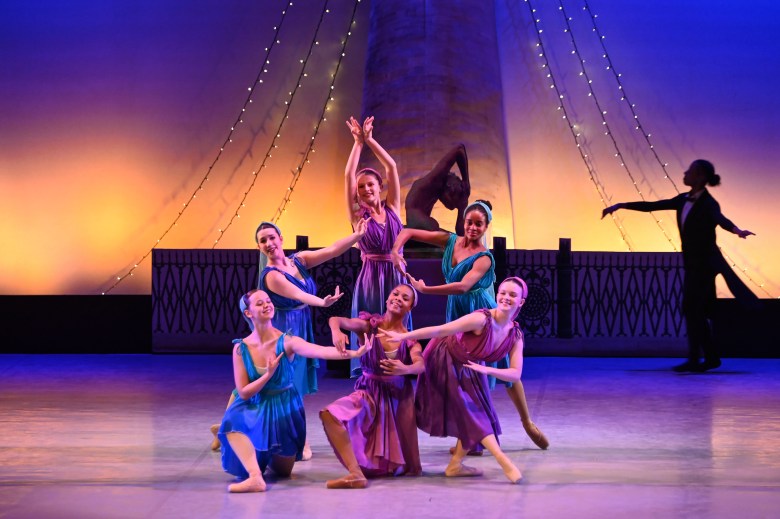 Dancers strike a pose on stage.
