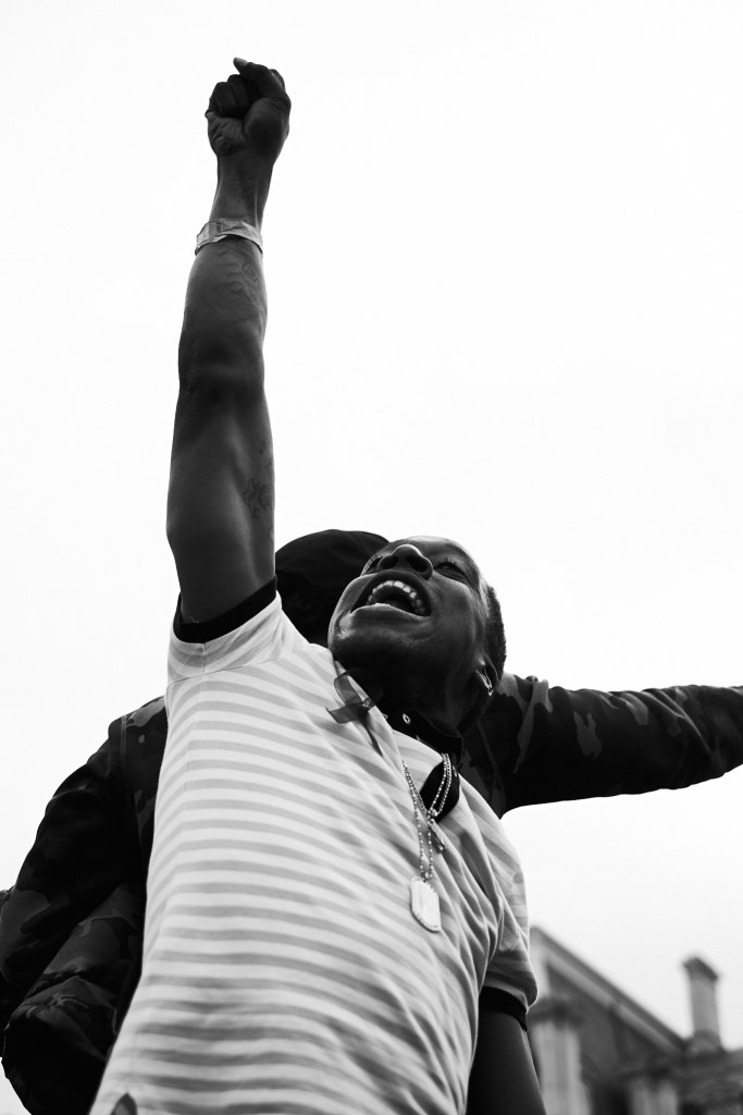 A man raises his fist.