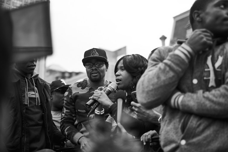 Activist and organizer Tawanda Jones speaks into a microphone.