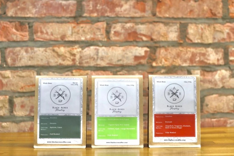 Three bags of coffee on display. 