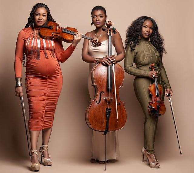 A photograph of three black women.