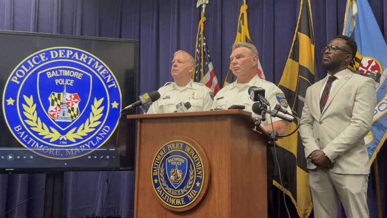 A photo of a group of men at a Baltimore Police Department press conference.