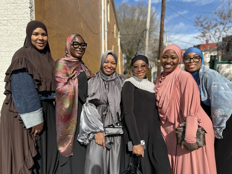 A photo of a group of smiling women.