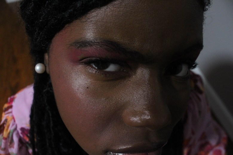 self portrait photograph of a person with brown skin