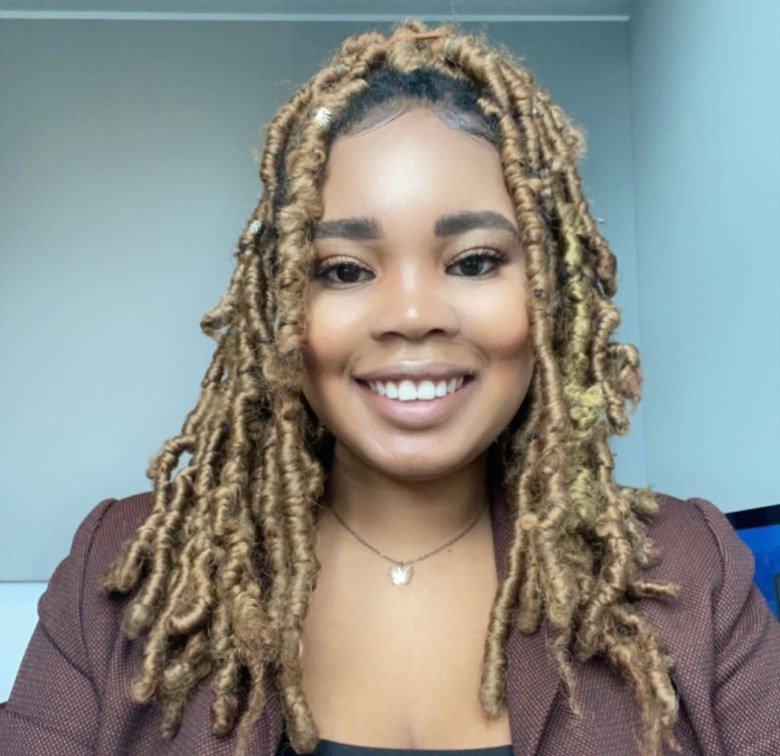 A photo of a smiling woman.