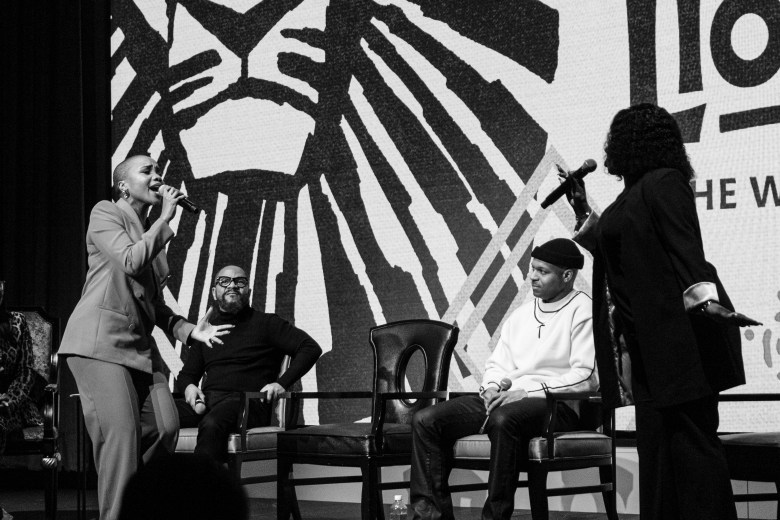 Cast members of the lion king sing on stage