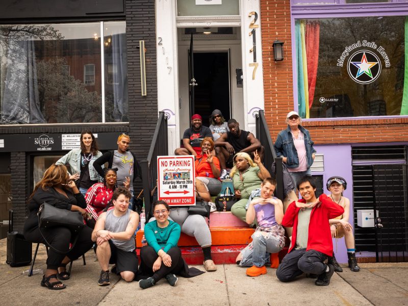 A group of people smile and pose for a photo.
