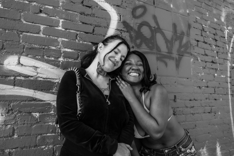 Photo of two people smiling and posing. 