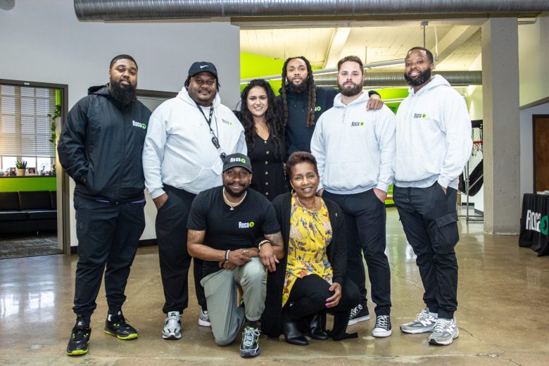 Eight people posing for a photo.