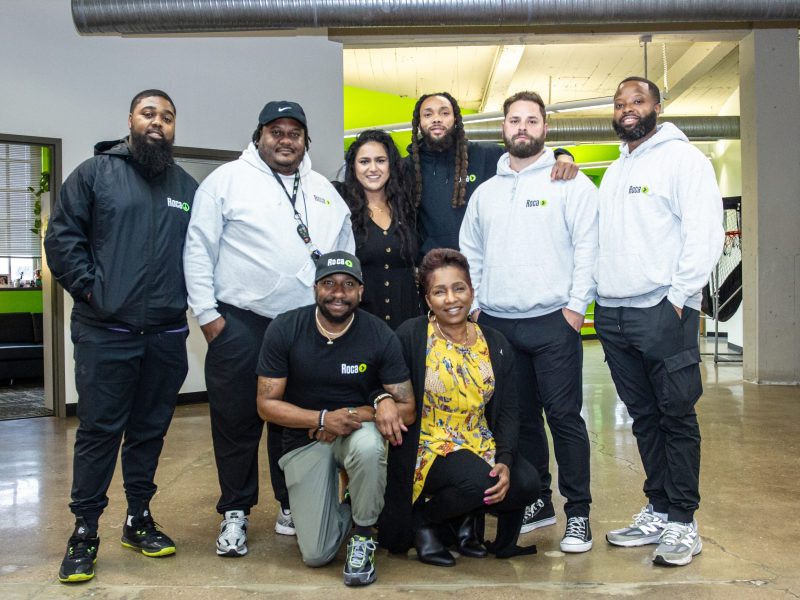 Eight people posing for a photo.