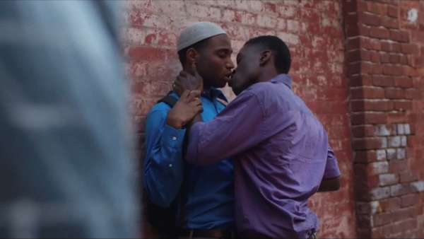 two men with brown skin in an embrace