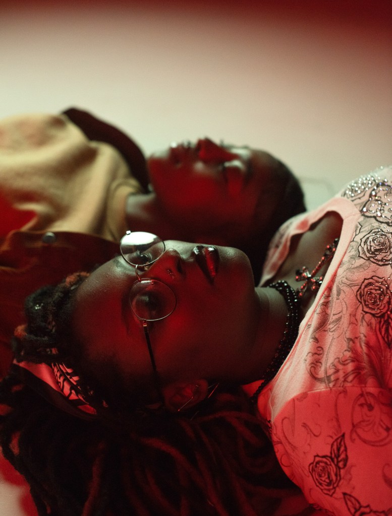 Two people lay next two each other.