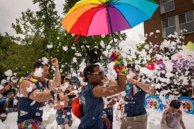 Morgan Stanley employees enjoy the foam sprayers in the 2025 Baltimore Pride Parade.