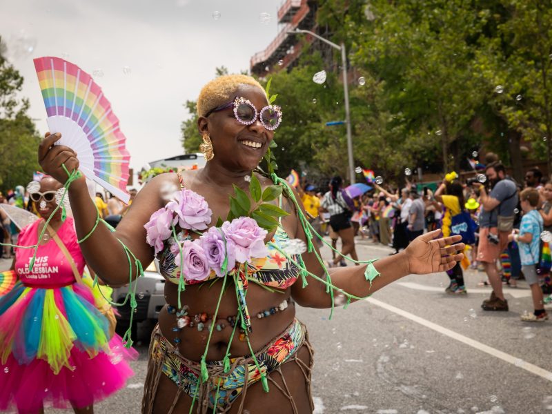 One of the people walking in the Pride Parade with the Charm City Kitty Club.