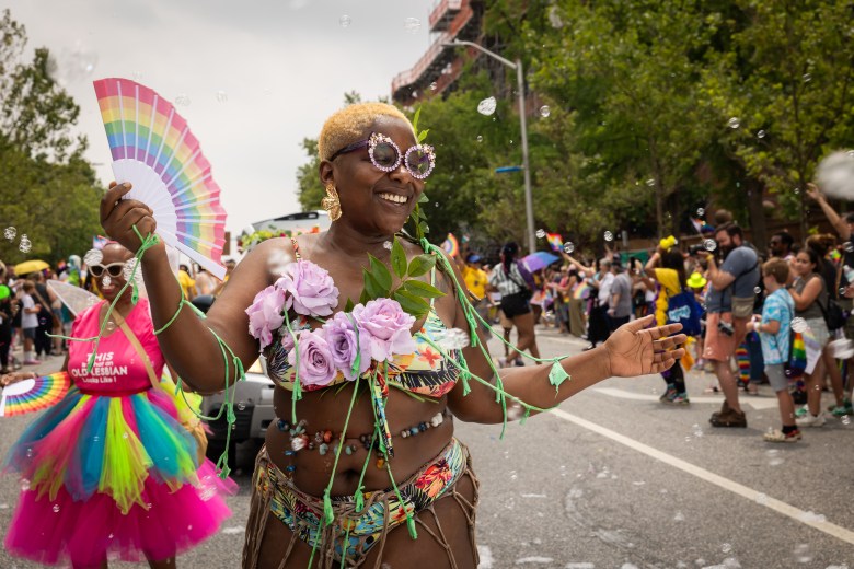 One of the people walking in the Pride Parade with the Charm City Kitty Club.
