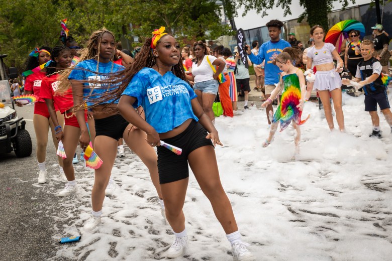 Dancers from the Baltimore Children and Youth Fund perform while moving through the foam from Paint Me Silly Rentals’ foam sprayer.