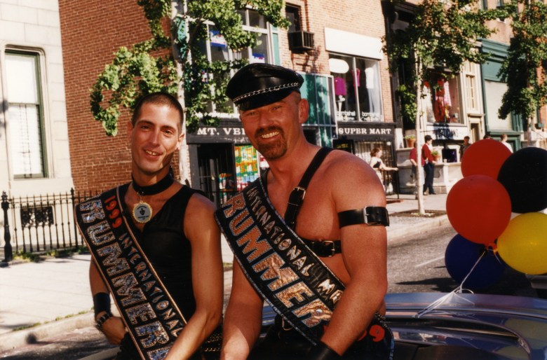  Two leather daddies wearing commemorative sashes sit in the back of a convertible during the Baltimore Pride Parade in 2000, which traverses north up Charles Street, through the Mount Vernon neighborhood.