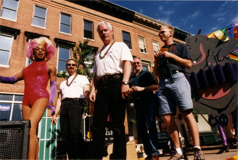 Five participants standing on the Club Hippo float during the Pride Parade in Baltimore, Maryland. 