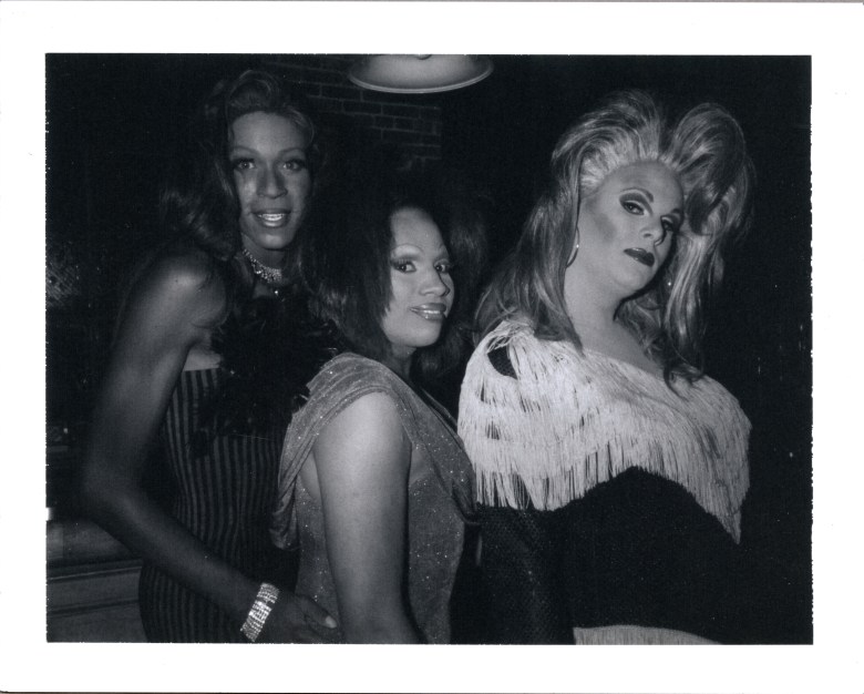 Group portrait of three people dressed in drag captured by the photographer Joseph Kohl.