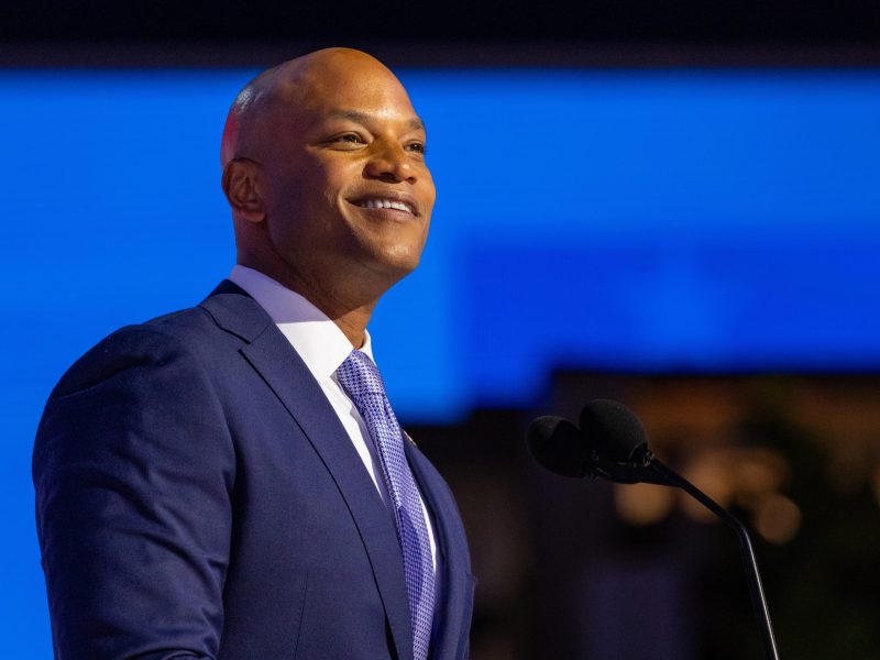 Color photo of Governor Wes Moore, he has brown skin and is wearing a blue suit.