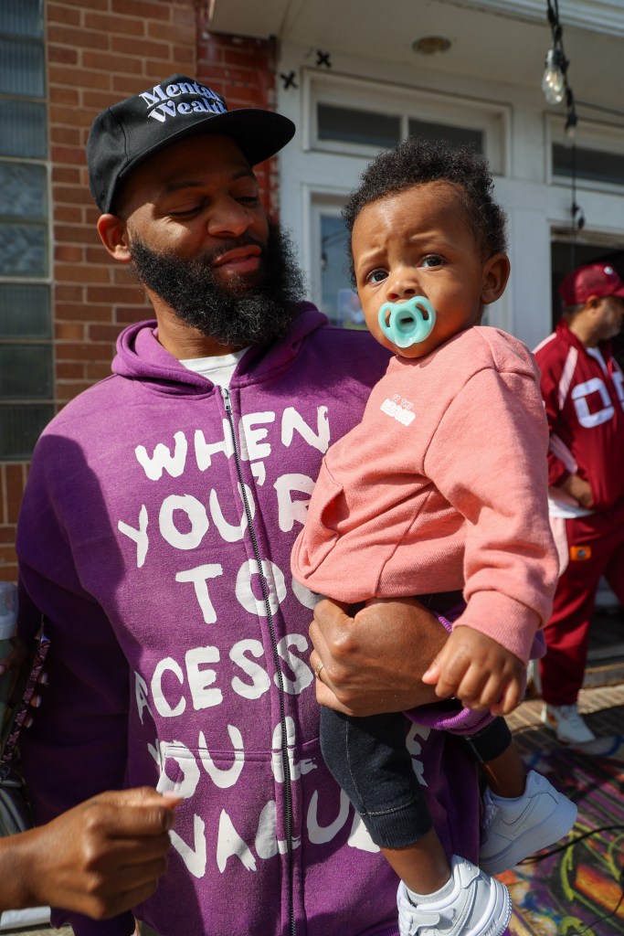 An adult holds a baby.