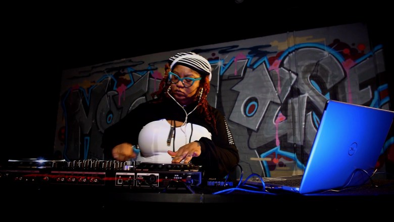 Photograph of a person DJing