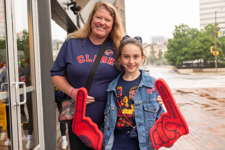 A woman and her daughter pose for the camera. 