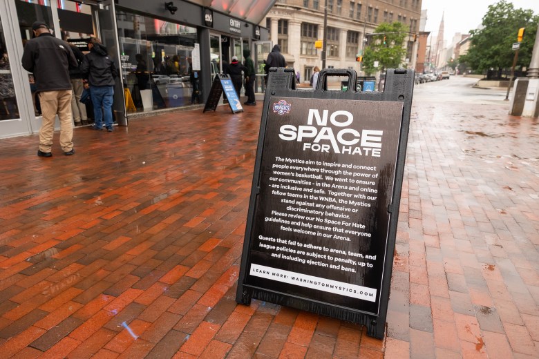 A sign outside the arena has the words "no space for hate" on it.
