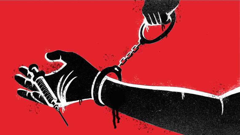An illustration of a hand holding a syringe. The hand has a pair of handcuffs attached to it at the wrist.