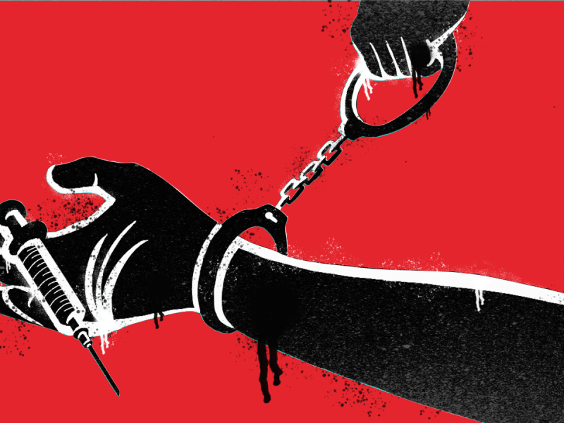 An illustration of a hand holding a syringe. The hand has a pair of handcuffs attached to it at the wrist.