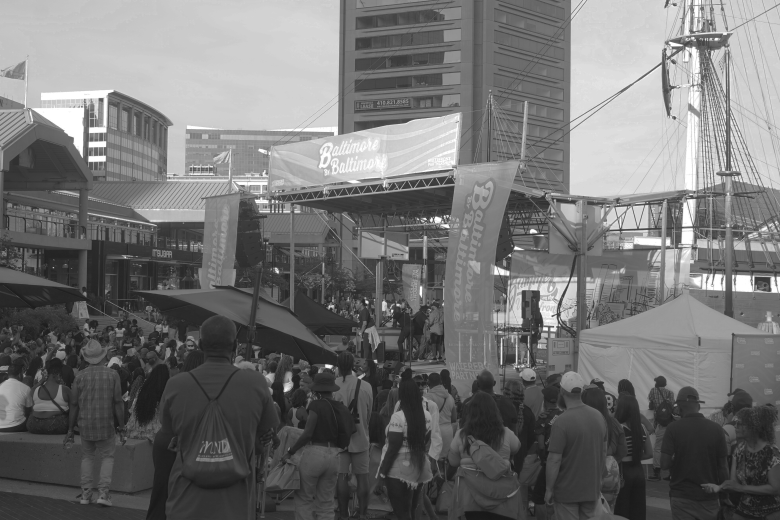 A crowd at a house music concert in the inner harbor